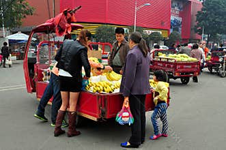 Pengzhou, China: Family Buying Bananas