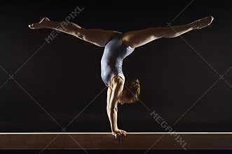 Gymnast Doing Split Handstand On Balance Beam