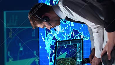 Workplace of the air traffic controllers in the control tower. Team of professional aircraft control officers works