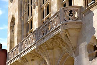 carved stone balcony on stone exterior wall. finely sculpted details in Budapest.