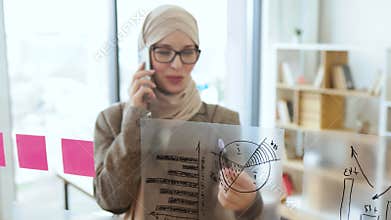 Female administrative manager preparing for presentation at work.