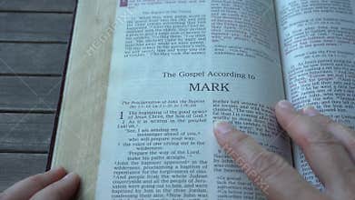 Open up the Holy Bible to the book of Mark in the bible.