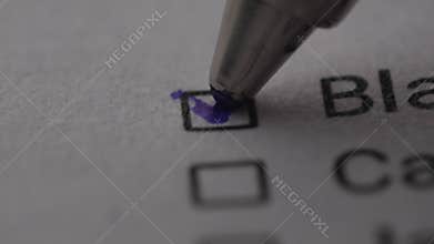 Pen mark a Checkbox labeled &#x27;Black&#x27; on a document.