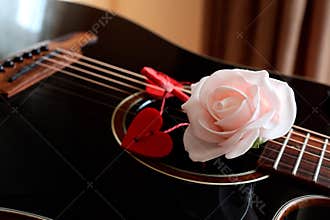Rose and hearts on the guitar neck for Valentine\'s Day.