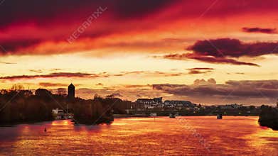 Dramatic stunning red sky at sunset over Neckar river
