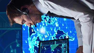 Workplace of the air traffic controllers in the control tower. Team of professional aircraft control officers works