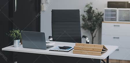Stylish workspace with desktop computer, office supplies, houseplant and books at office. desk work concept