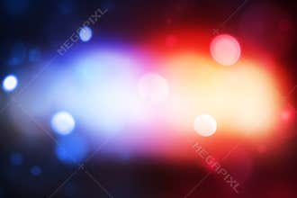 Police light glowing in bokeh blur style, background design. Modern blue and red police lights concept backdrop