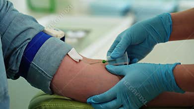 Close-up of unrecognizable laboratory worker taking blood sample for antibodies to virus. Closeup of female nurse