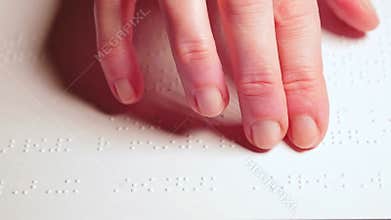 Woman reading braille text