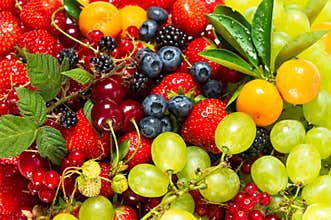 Mix of fresh fruits and berries. raw food ingredients