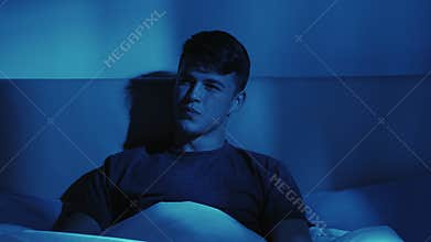 Night leisure home cinema guy watching tv in bed