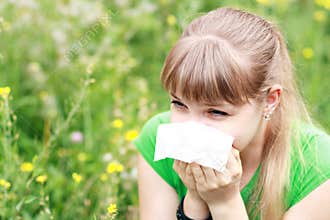 Young woman sneezing