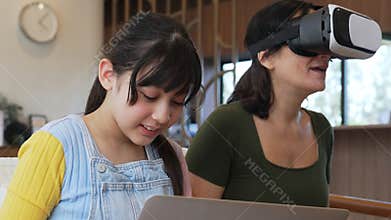 Granddaughter guide grandmother to dive in metaverse with VR. Divergence.