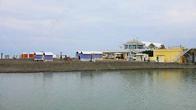 Beach with bungalow, houses on sand bar, Sochi,