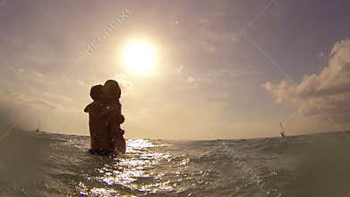 Young couple having fun in the sea