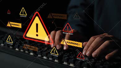 Hands typing on a keyboard with holographic warning alerts and security symbols indicating cyber threats and system
