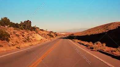 POV Shot Driving Down Road in the Desert