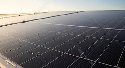 Close up of solar panel with water droplets on surface outdoors