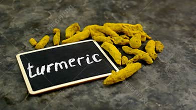 Turmeric root for supplements and essential oils. Selective focus.