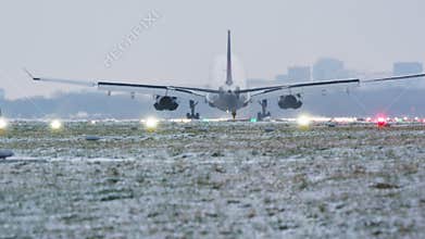 Commercial Jet Landing on Snowy Winter Runway