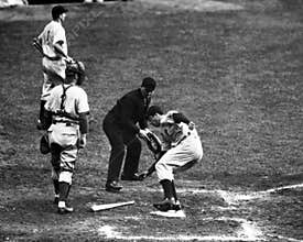 Joe DiMaggio steps on Homeplate.