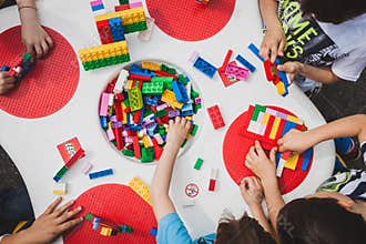 Children play with Lego bricks in Milan, Italy