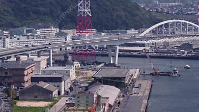 Aerial View of Hiroshima with White Arched Bridge and Harbor Activity