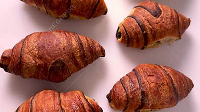 Chocolate croissants arranged neatl