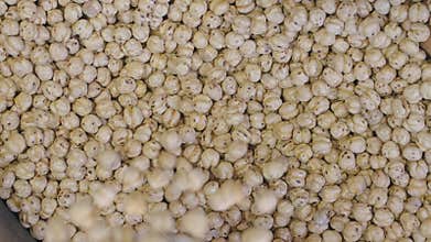 Roasting chickpeas in a traditional market setting