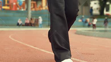 Low Angle View of Person Walking on Athletic Track