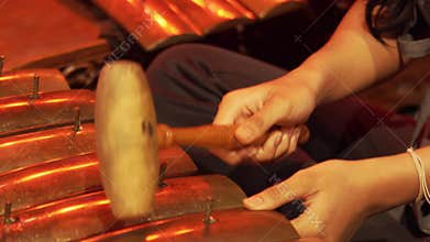 Playing a Traditional Gamelan Metallophone Close-Up