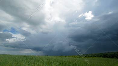 Time-lapse dramatic sky and wheat field.