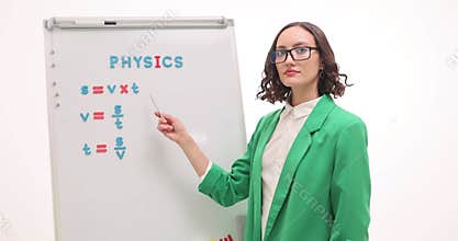 Lady explains distance formula giving physics lesson at school