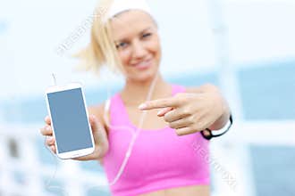 Young woman showin phone