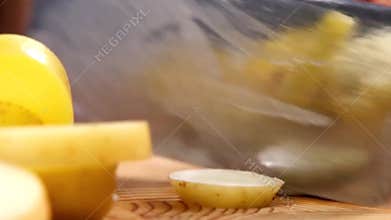 Slicing potatoes into bite-sized pieces