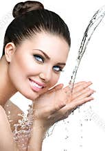 Beautiful model woman with splashes of water