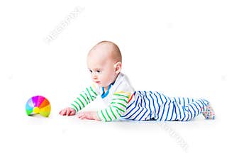 Happy laughing funny baby boy learning to crawl