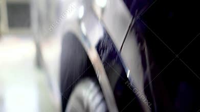 Close-up of interior cleaning in a car. A worker dirty car water blaster with a vacuum cleaner. Car dry cleaning.
