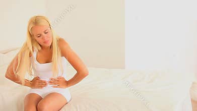 Woman having pain in her stomach