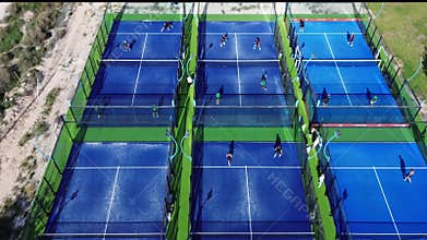 November 20, 2025, Spain, Alicante, Padel Road Sports Club, people play paddle tennis on outdoor courts.