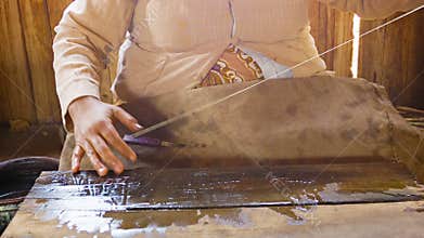 Old traditional method of making yarn from lotus juice. Burma