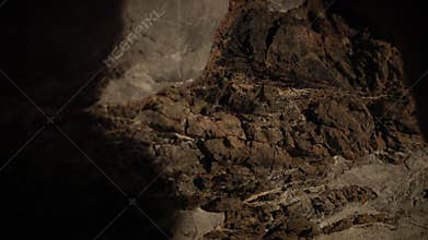 Meditation in a cave texture with stalactites and stalagmites in darkness.