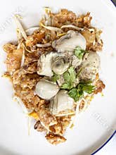 Asian delicious fried oysters with eggs omelette, popular cuisine food in asia