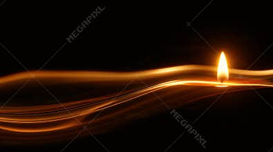 Single Flame with Abstract Golden Light Trails on Black Background
