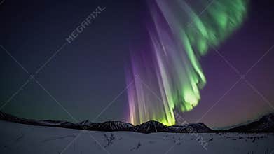 Aurora borealis sweeping above snowy mountains, vibrant green and purple curtains dancing across night sky, ethereal