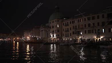 Night view of San Simeone Piccolo church and Grand Canal buildings in Venice
