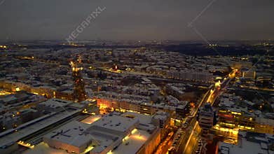 Berlin City rooftops covering in snow at dusk. Fabulous aerial view drone