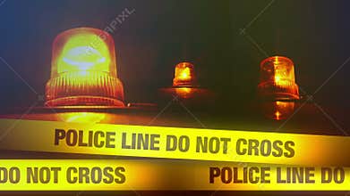 Police Line Do Not Cross Yellow Headband Tape and Orange flashing and revolving light