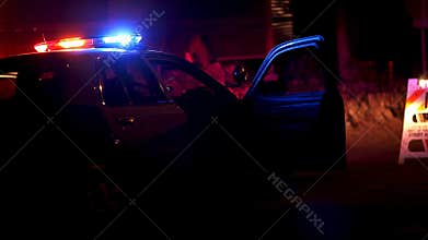 Police Car with Lights Flashing at Roadblock